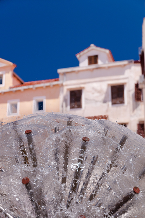 Dandelion fountain and houses at Mali Losinj in Croatiaの写真素材