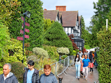 BHAKTIVEDANTA MANOR, UK - AUGUST 28: Hindu festival celebrates Lord Krishna's birthday Janmashtami 2016. The faithful after visiting deities go out from the temple.のeditorial素材