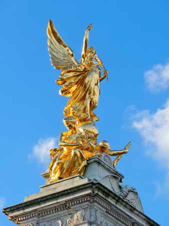 LONDON, FEBRUARY 04: Golden statue of Victoria Memorial against blue sky. UK 2017.のeditorial素材