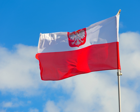 Polish flag with emblem of white eagle.の写真素材