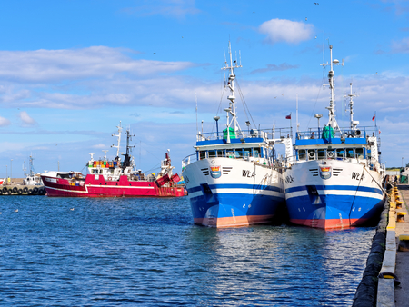 Fishing boats moored in a fishing port.の写真素材