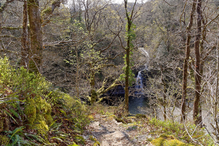 View of a waterfall on a tourist trail in the mountains of Snowdonia, Wales.の写真素材