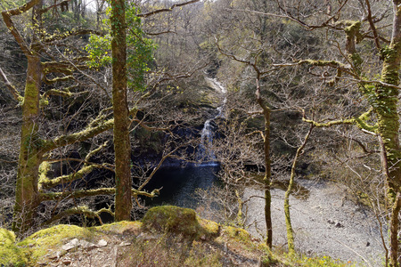 View of a waterfall on a tourist trail in the mountains of Snowdonia, Wales.の写真素材