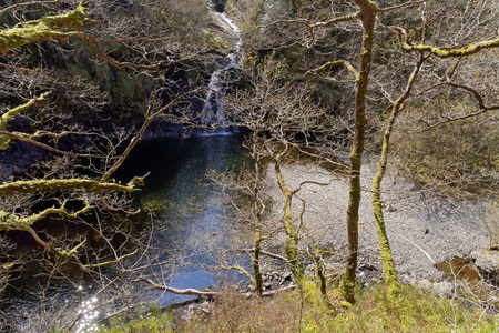 View of a waterfall on a tourist trail in the mountains of Snowdonia, Wales.の写真素材