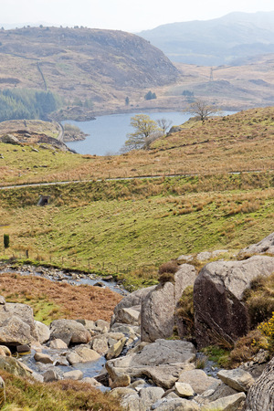 View of the valley from a flowing stream on the Cwmorthin Waterfall trail in the mountains of Snowdonia National Park, Wales.の写真素材