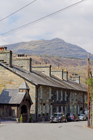 Entrance to the church through the clock tower in the village of Maentwrog in the mountains of Snowdonia, Wales, April 11, UK 2019のeditorial素材