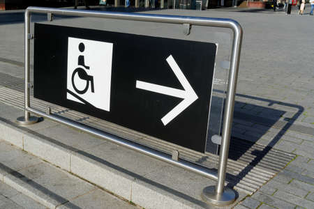 Information board for disabled people in a wheelchair to show the right way.の写真素材