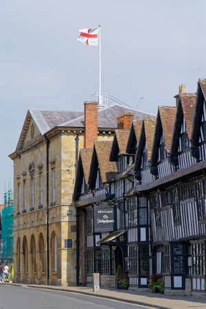 Stratford-Upon-Avon Town Hall with the flag of England waving on the roof in Stratford-upon-Avon,...