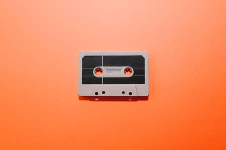 Audio cassette tape isolated on orange background. Copy spaceの写真素材