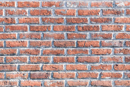 Red weathered stained brick wall. Background texture. High quality photo