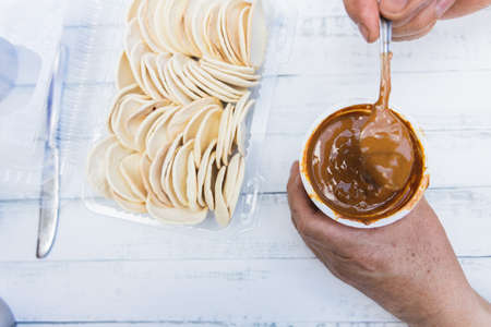 Old womans hans preparing alfajores. Latin food.の写真素材
