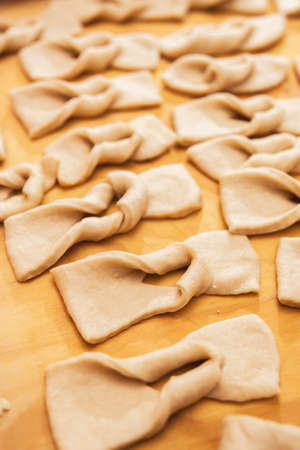 Dough on a wooden table. Chilean fried pastries. Latin food.の写真素材
