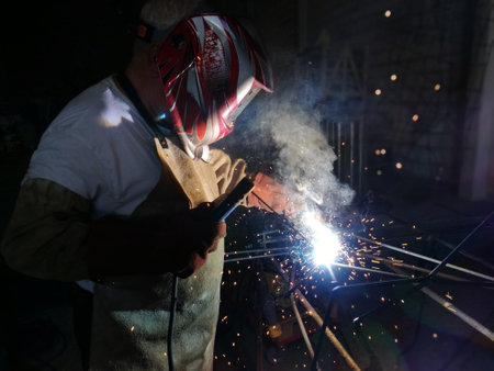 Worker welding iron