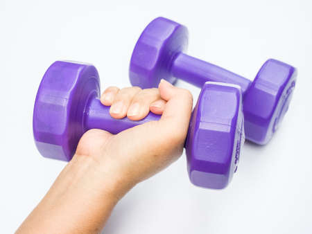 Close up shot of hand with dumbbell