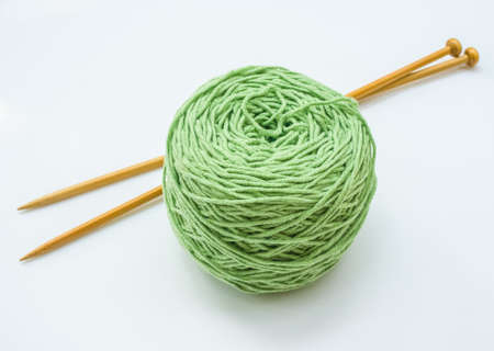 Green knitting yarn isolated on white backgroundの写真素材