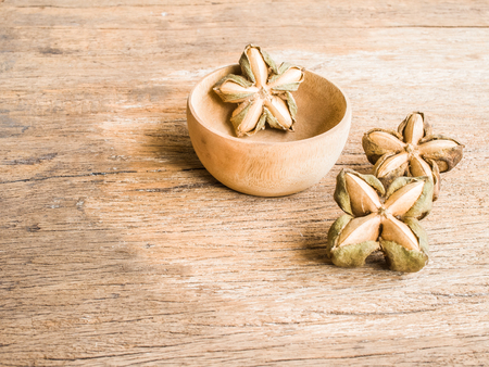 Inca nuts on wood backgroundの写真素材