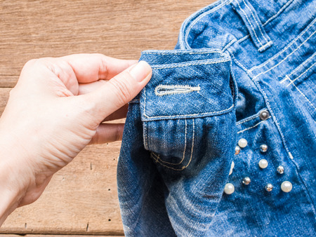 Woman hand DIY Short jeanの写真素材