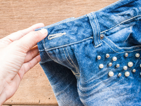 Woman hand DIY Short jeanの写真素材