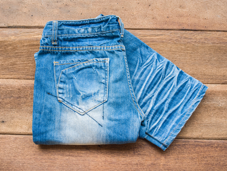 Closeup jean on wood backgroundの写真素材