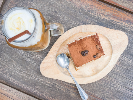 Coffee cream cake set on wood backgroundの写真素材