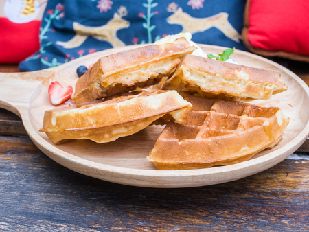 Waffles on wooden plateの写真素材