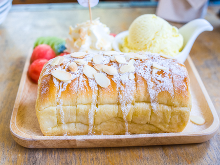 Honey toast with some fruits and vanilla ice creamの写真素材