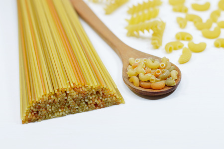 Composition of raw wholegrain pasta on white vintage wooden table.
の写真素材
