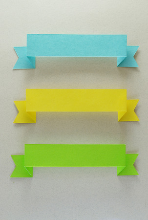 Trio of blue, yellow, and green stripes on beige background.の写真素材