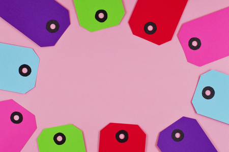 Set of colorful labels made of paper with pink backgroundの写真素材