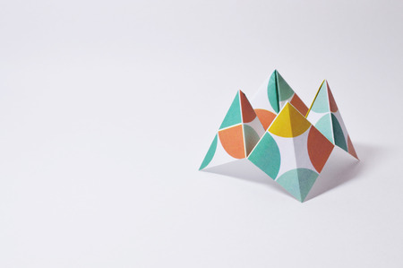 Origami figure paper in white backgroundの写真素材