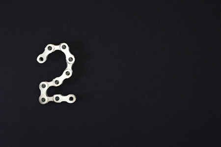 Iron bike chain showing numbersの写真素材