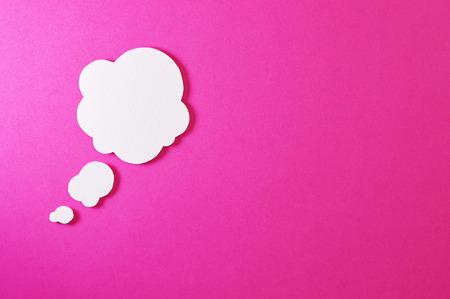 Paper bubble speech shapes on color backgroundの写真素材