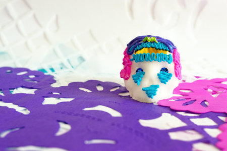 Traditional sugar skull on perforated paper of Day of the dead