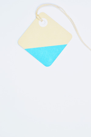 Paper tag on white background, ideal for your shopping projects or business topics.の写真素材