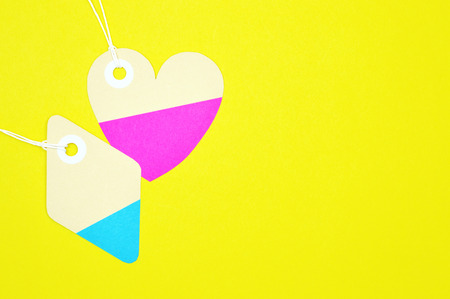 Paper tag on color background, ideal for your shopping projects or business topics.の写真素材