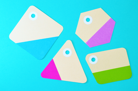 Paper tag on color background, ideal for your shopping projects or business topics.の写真素材