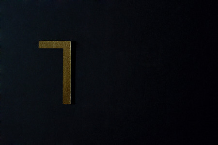 Template of gold sans serif number on dark background.の写真素材