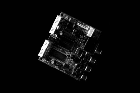 Black and white template of circuit board on dark background.