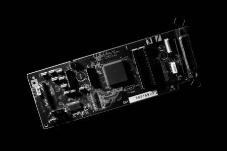 Black and white template of circuit board on dark background.