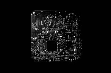 Black and white template of circuit board on dark background.