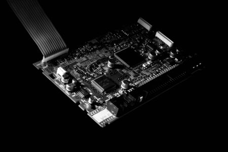 Black and white template of circuit board on dark background.