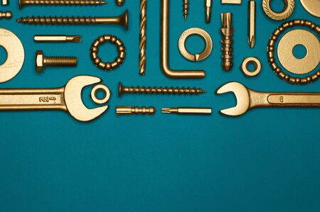 Template of golden tools on blue background for industry projects or mechanics topics.の写真素材