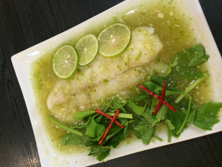 spicy steamed fish in lemon sauceの写真素材