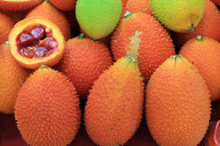 A Southeast Asian fruit, commonly know as Gac, Baby Jackruit, Spiny Bitter Gourd, Sweet Grourd or Cochinchin Gourd. Very delicious and medicinal propertiesの写真素材