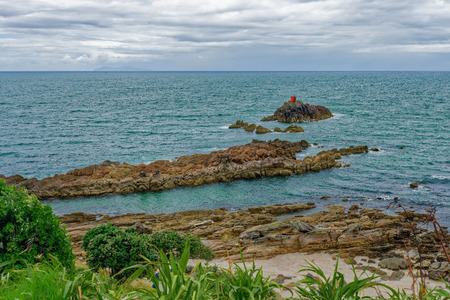 Tauranga, New Zealand - January 15, 2018:  Rock formations in Bay of Plenty. Mount Maunganui is also the name of the large lava dome which was formed by the upwelling of rhyolite lava about two to three million years agoのeditorial素材