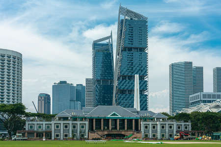 Singapore, Singapore - May 21, 2018: Padang with commercial towers behind