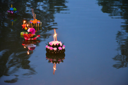 Candles floating on the water in a temple, closeup of photoの写真素材