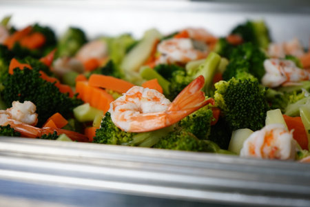 salad with shrimps and vegetables in a stainless steel dishの写真素材