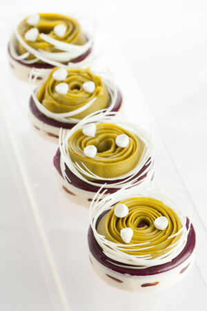 chocolate pistachio cake on a transparent plateの写真素材