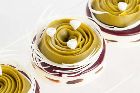 chocolate pistachio cake on a transparent plateの写真素材